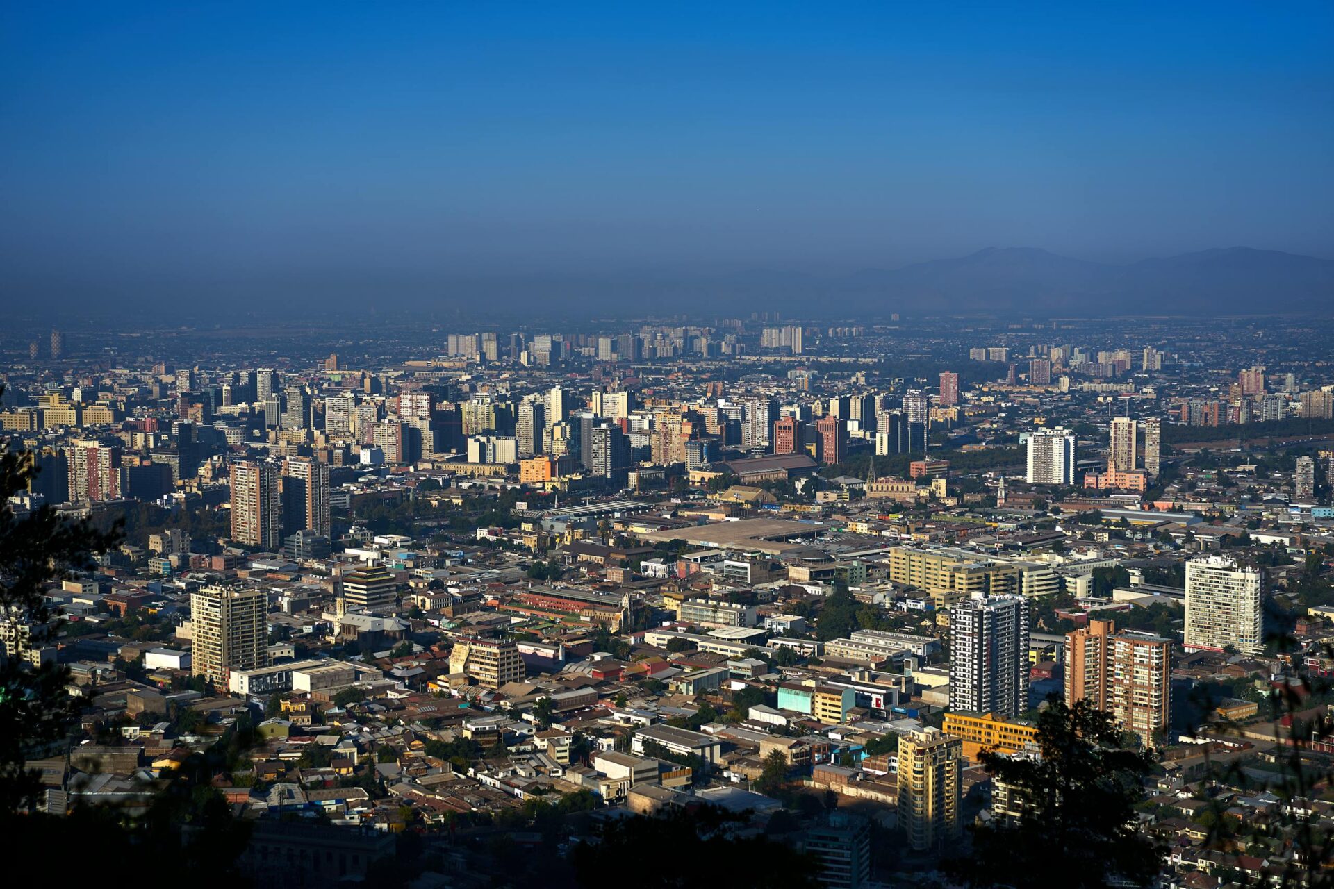 Panoramic view of Santiago, Chile, showcasing modern architecture and urban landscape.